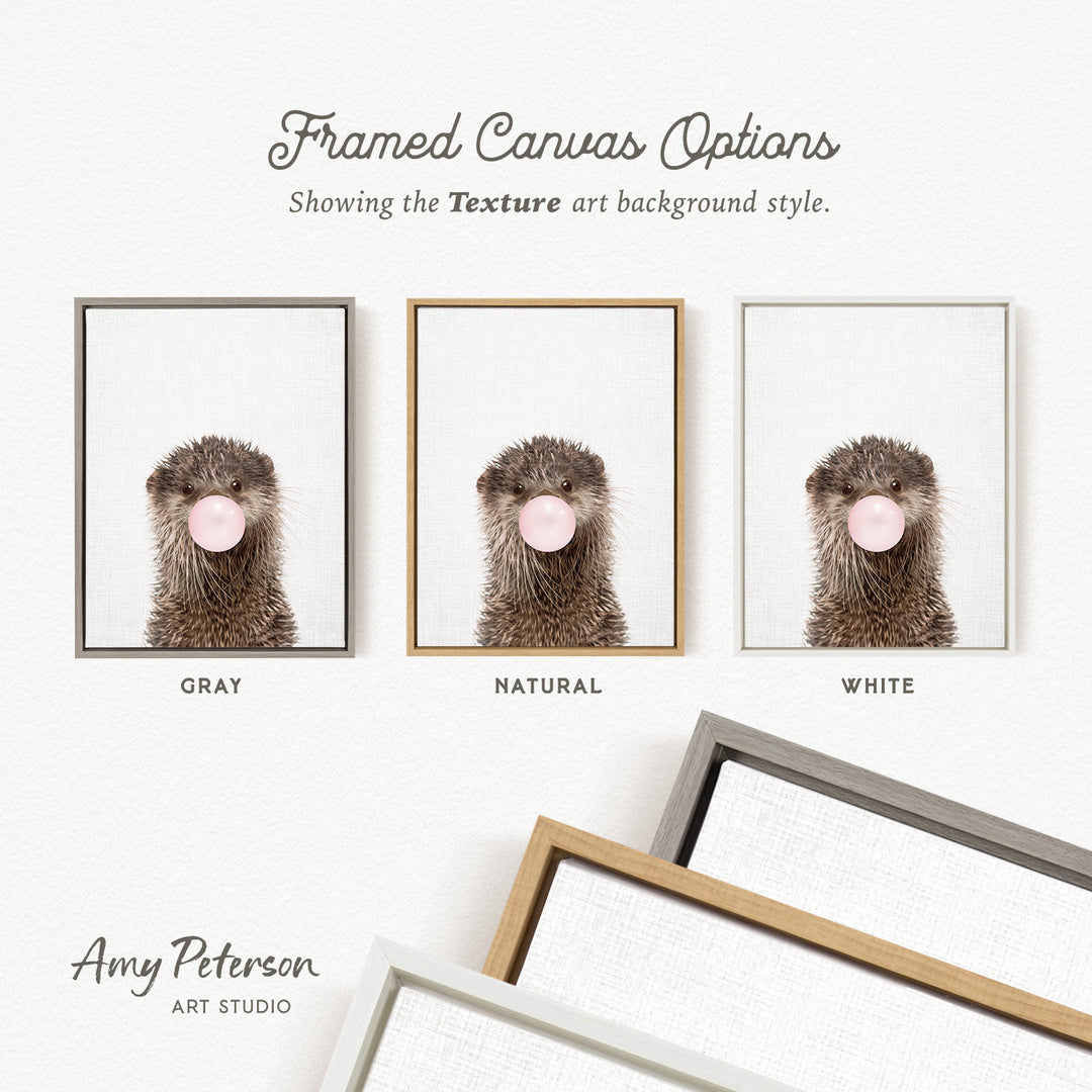 three framed canvas options, each featuring a close-up of an otter blowing a bubble with a pink bubblegum bubble. The options are labeled with the color gray, natural, and white.