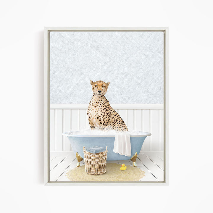 A cheetah sitting in a blue bathtub filled with water, surrounded by a yellow rubber duck and a wicker basket.