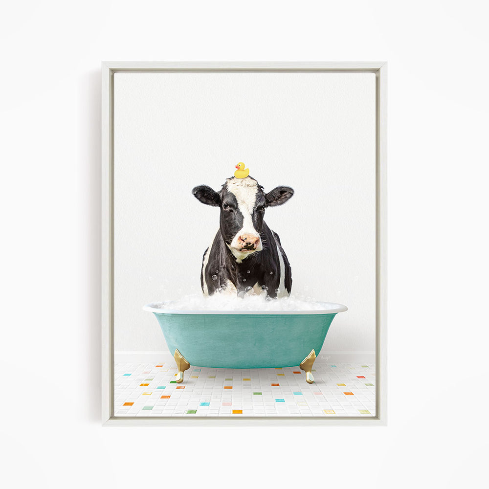 A black and white cow is standing in a green bathtub filled with water, with a yellow rubber duck perched on its head.
