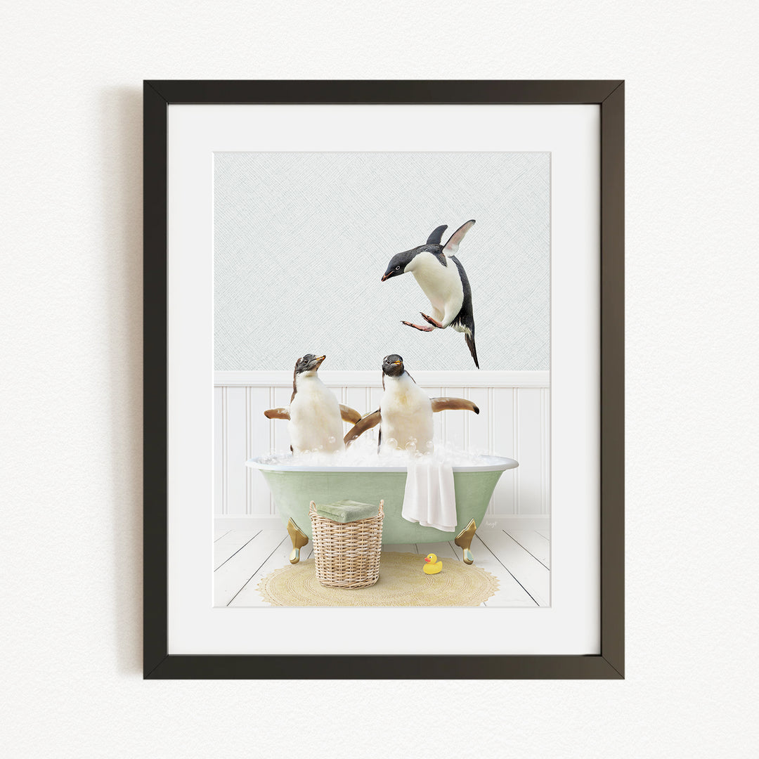 A framed image depicting two penguins sitting in a bathtub, with one penguin flying towards the other penguin.