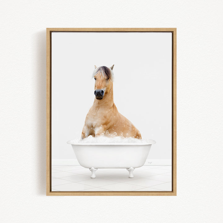 A brown horse sitting in a white bathtub filled with bubbles, looking directly at the camera.