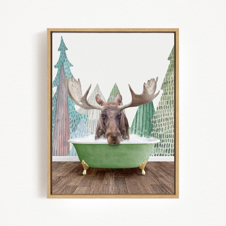 A moose with large antlers is sitting in a green bathtub, surrounded by a forest scene with trees and a snowy landscape.