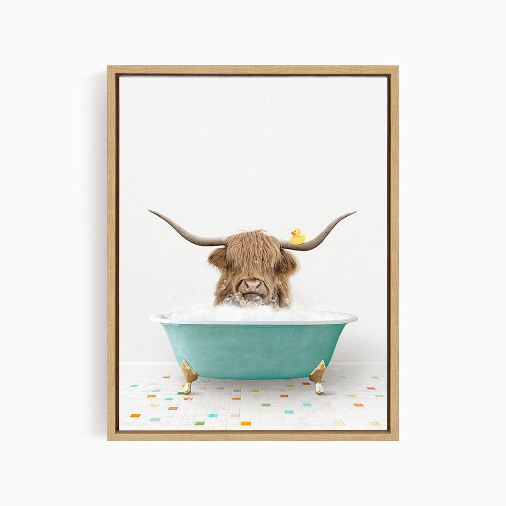 A brown cow with long horns is sitting in a blue bathtub, with a yellow rubber duck floating on the water.