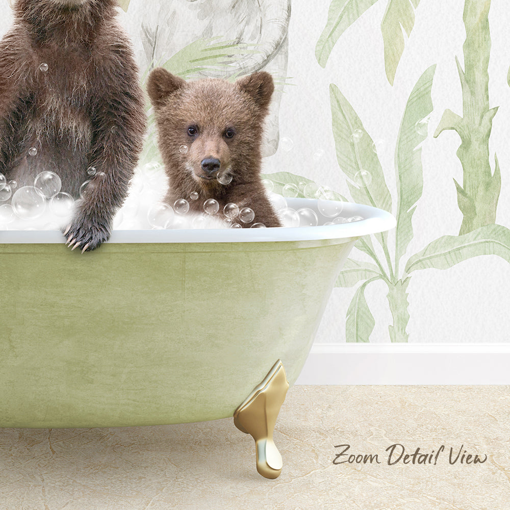 A baby bear sitting in a bathtub filled with bubbles, with a wall featuring a plant-like pattern in the background.