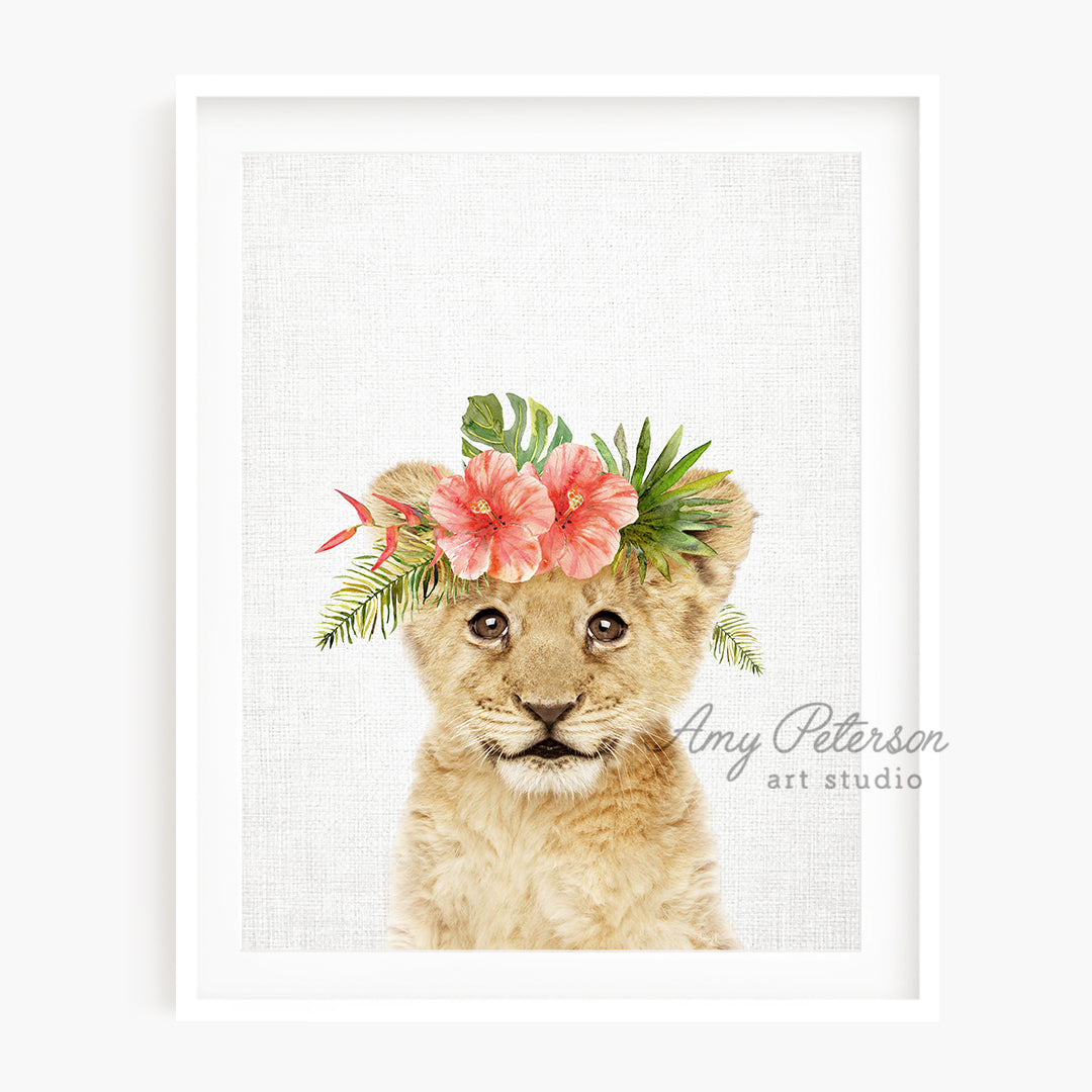 a picture of a lion cub wearing a flower crown