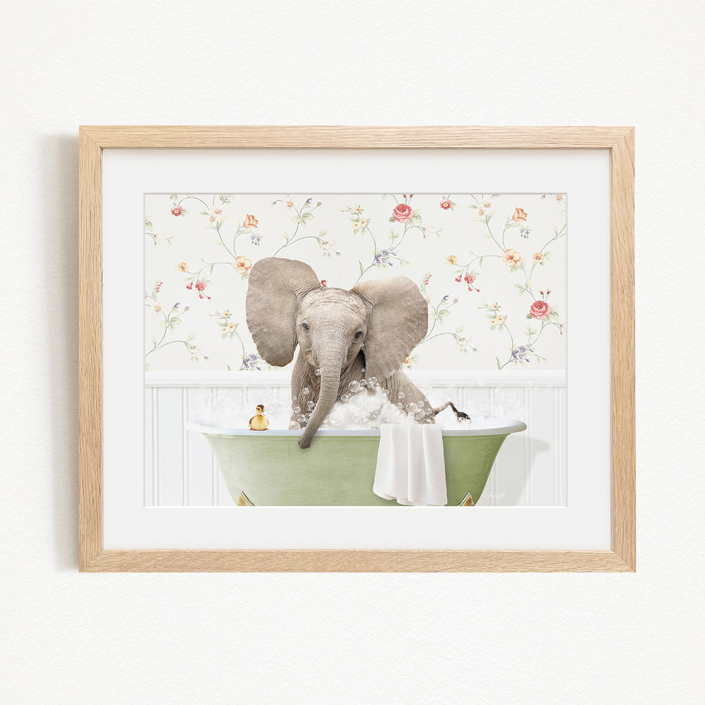 A baby elephant sitting in a green bathtub, surrounded by a floral wallpaper.