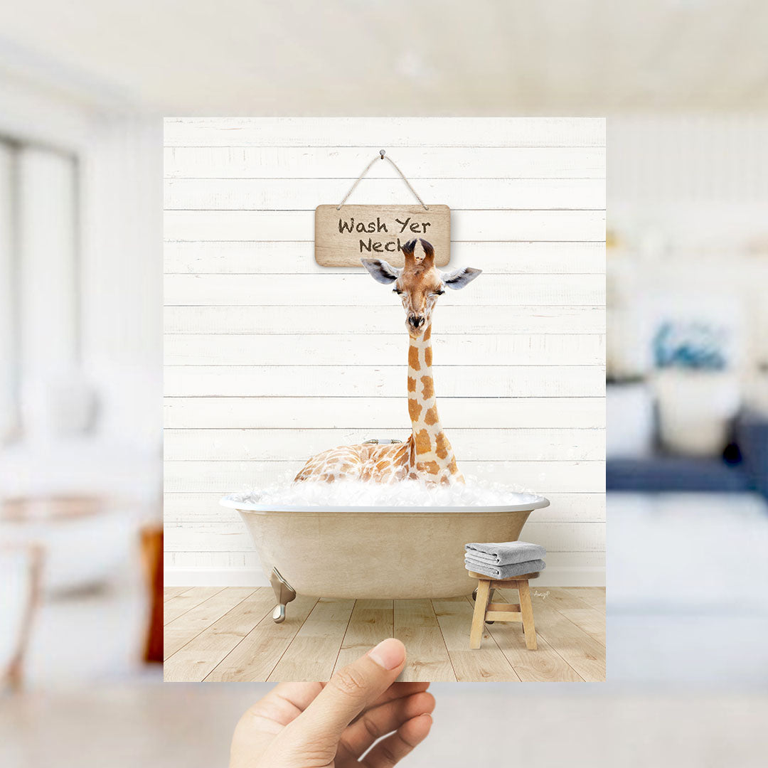 A giraffe sitting in a bathtub with a sign that says "Wash Your Neck" hanging above it.