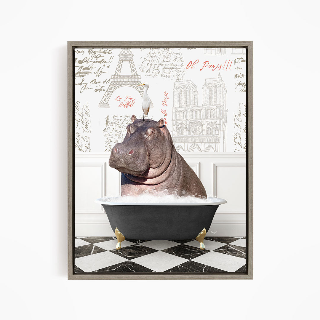 A framed image depicting a hippopotamus sitting in a bathtub, with a bird perched on its head. The background features a collage of various architectural elements, including the Eiffel Tower and the Notre-Dame Cathedral.
