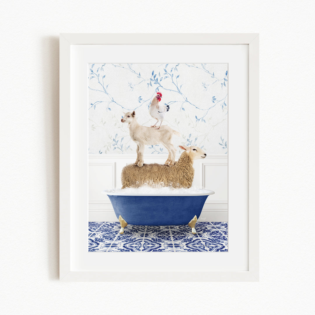 A framed image depicting a sheep standing on a goat's back while a chicken stands on top of a sheep in a blue bathtub.