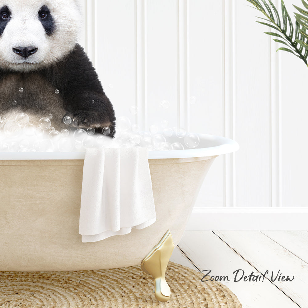 A panda bear sitting in a bathtub filled with bubbles, with a towel and a plant nearby.