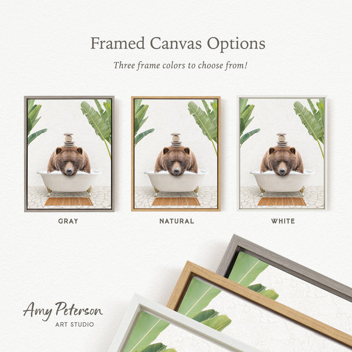 three framed canvas options, each featuring a brown bear sitting in a bathtub. The options include a gray frame, a natural frame, and a white frame.