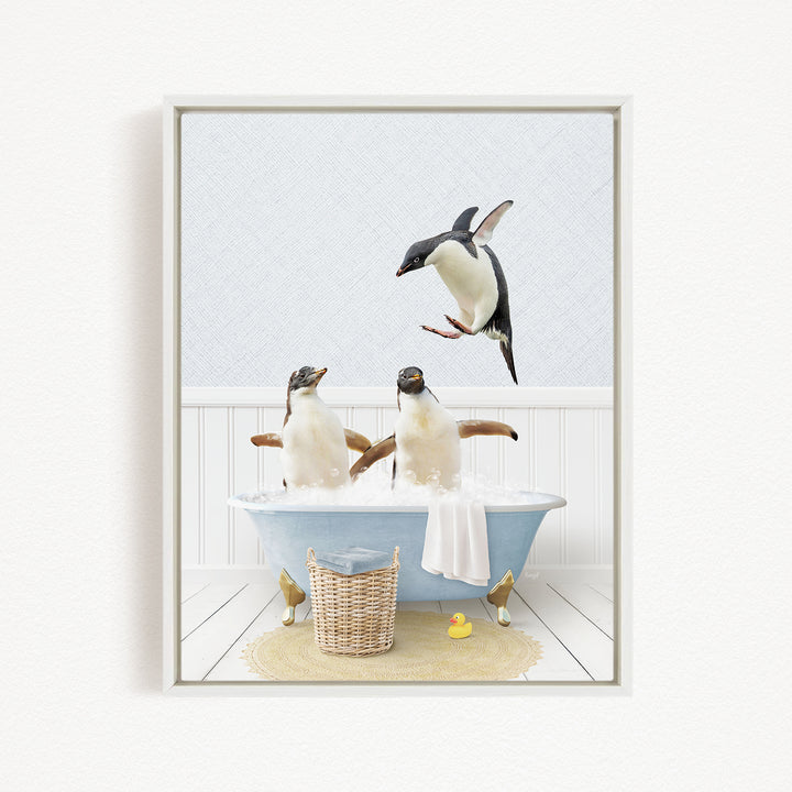 A framed image depicting two penguins sitting in a bathtub, with one penguin flying towards the other penguin.