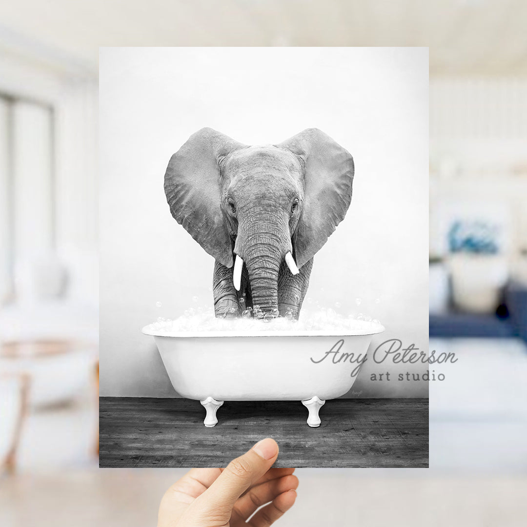 a black and white photo of an elephant in a bathtub