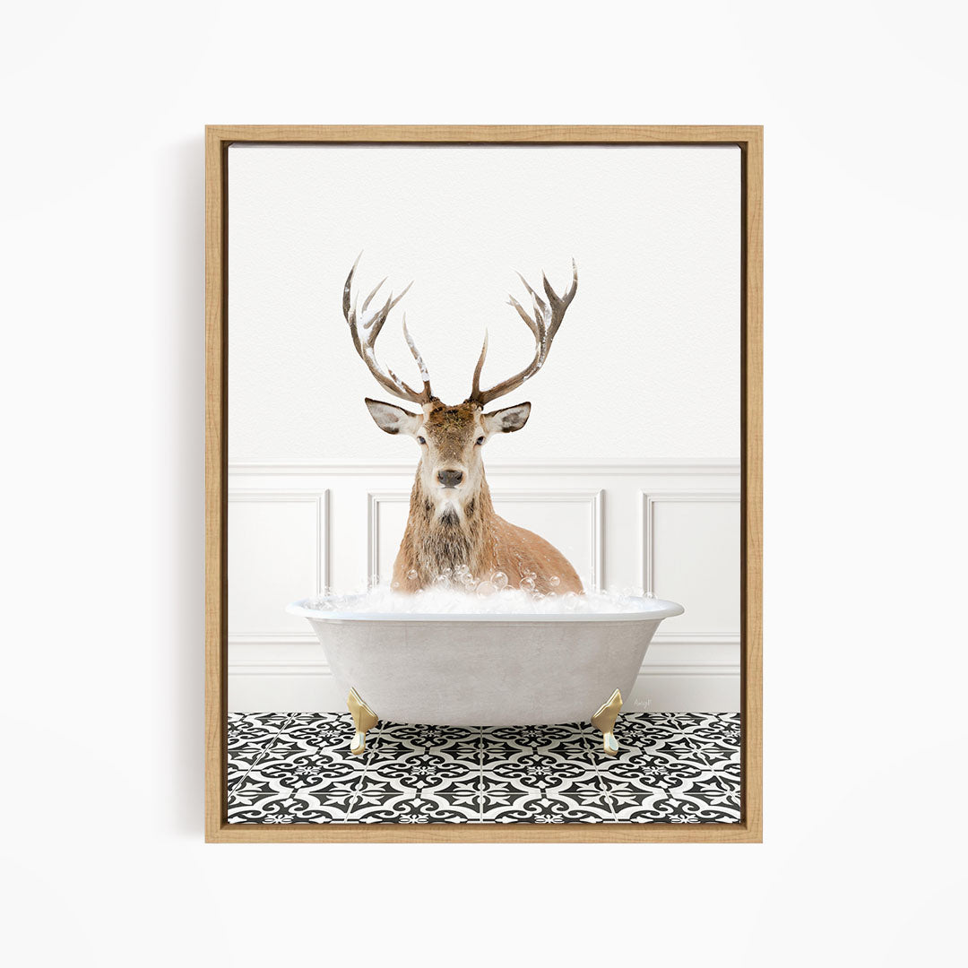 A deer with large antlers is sitting in a bathtub filled with water, creating a whimsical and unexpected scene.
