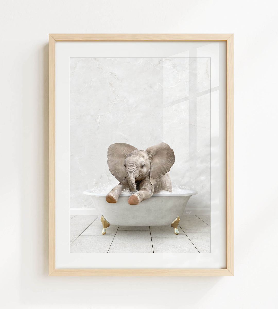 A baby elephant sitting in a white bathtub, with its trunk raised and ears spread out, creating a playful and whimsical scene.