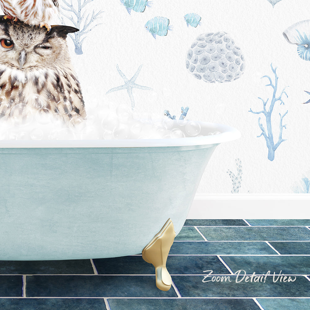 A large owl is sitting in a bathtub filled with bubbles, surrounded by a blue and white ocean-themed wallpaper.