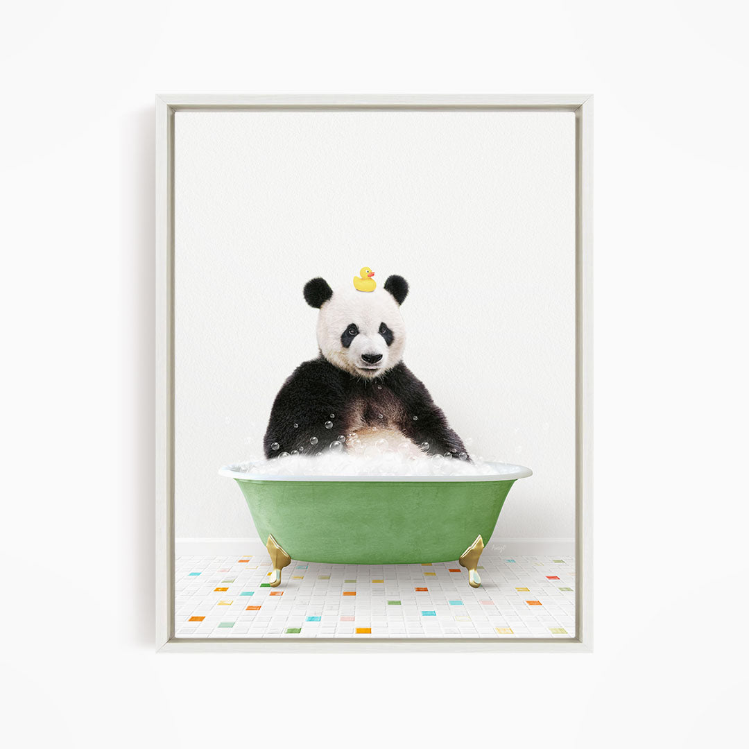 A panda bear sitting in a green bathtub, with a rubber duck on its head, against a white background.