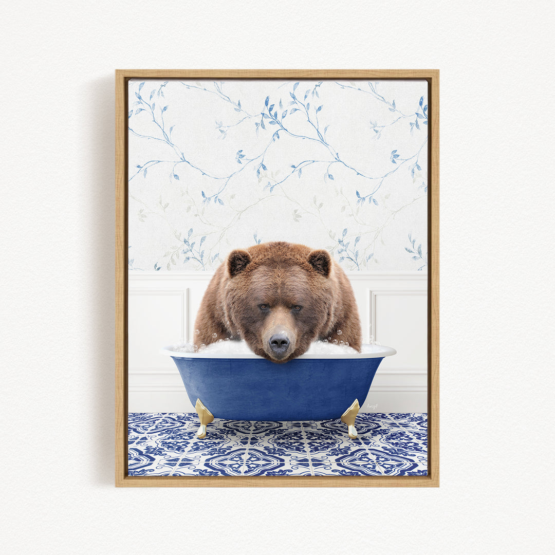 A brown bear is sitting in a blue bathtub, with its head resting on the edge of the tub, appearing relaxed and content.