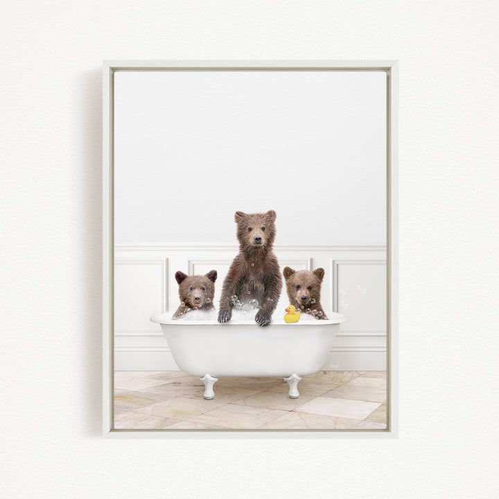 A group of adorable brown bears enjoying a bath in a white bathtub, with one bear holding a rubber duck.