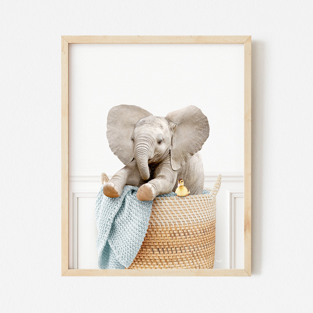 a picture of an elephant sitting in a basket