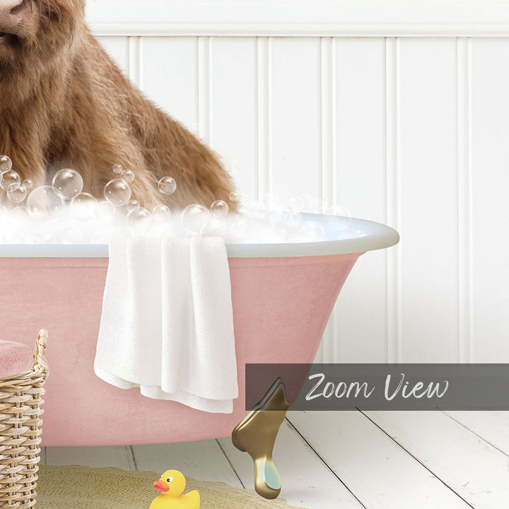 A brown dog is sitting in a pink bathtub filled with bubbles, surrounded by a yellow rubber duck and a white towel.