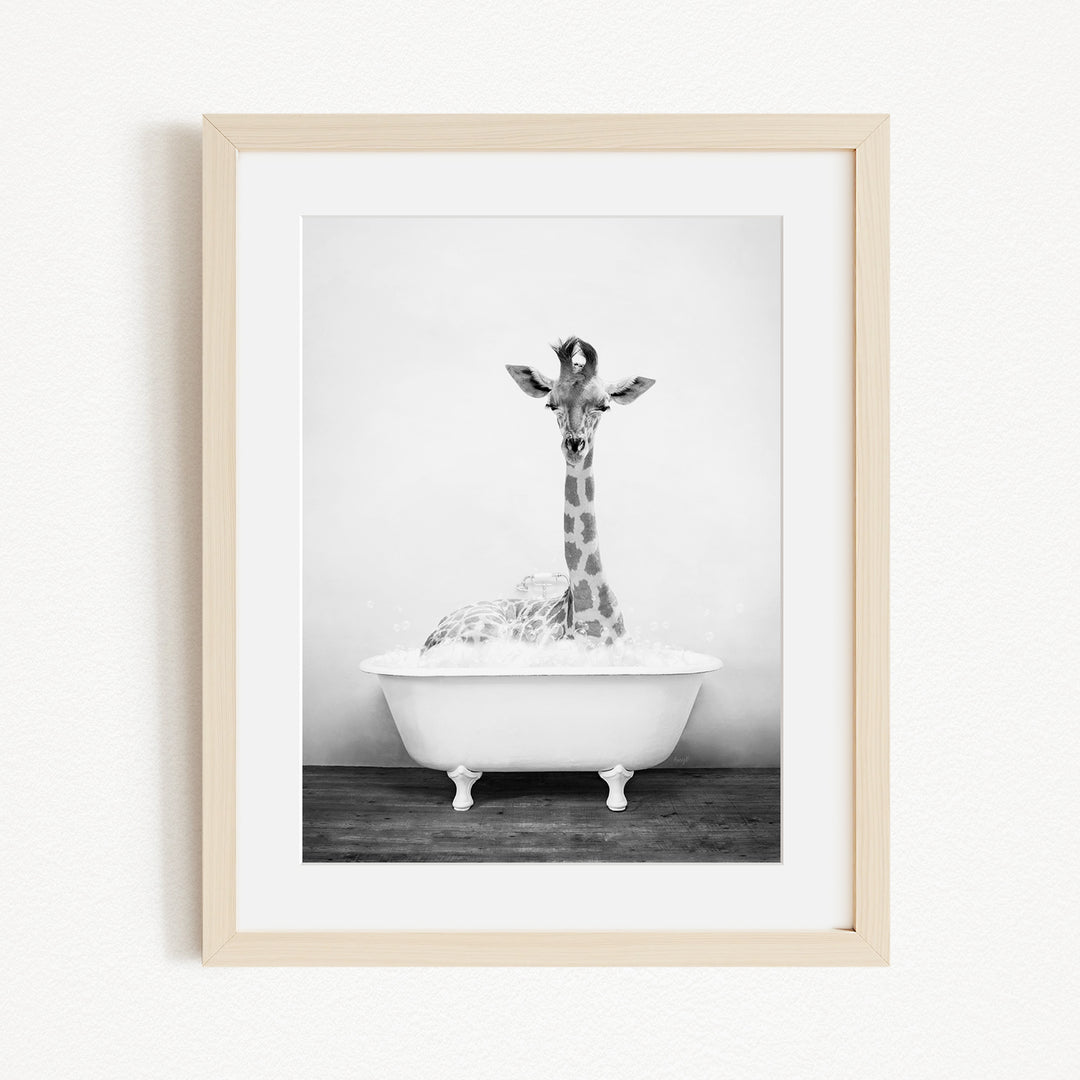 A giraffe standing in a white bathtub filled with water, creating a whimsical and playful scene.