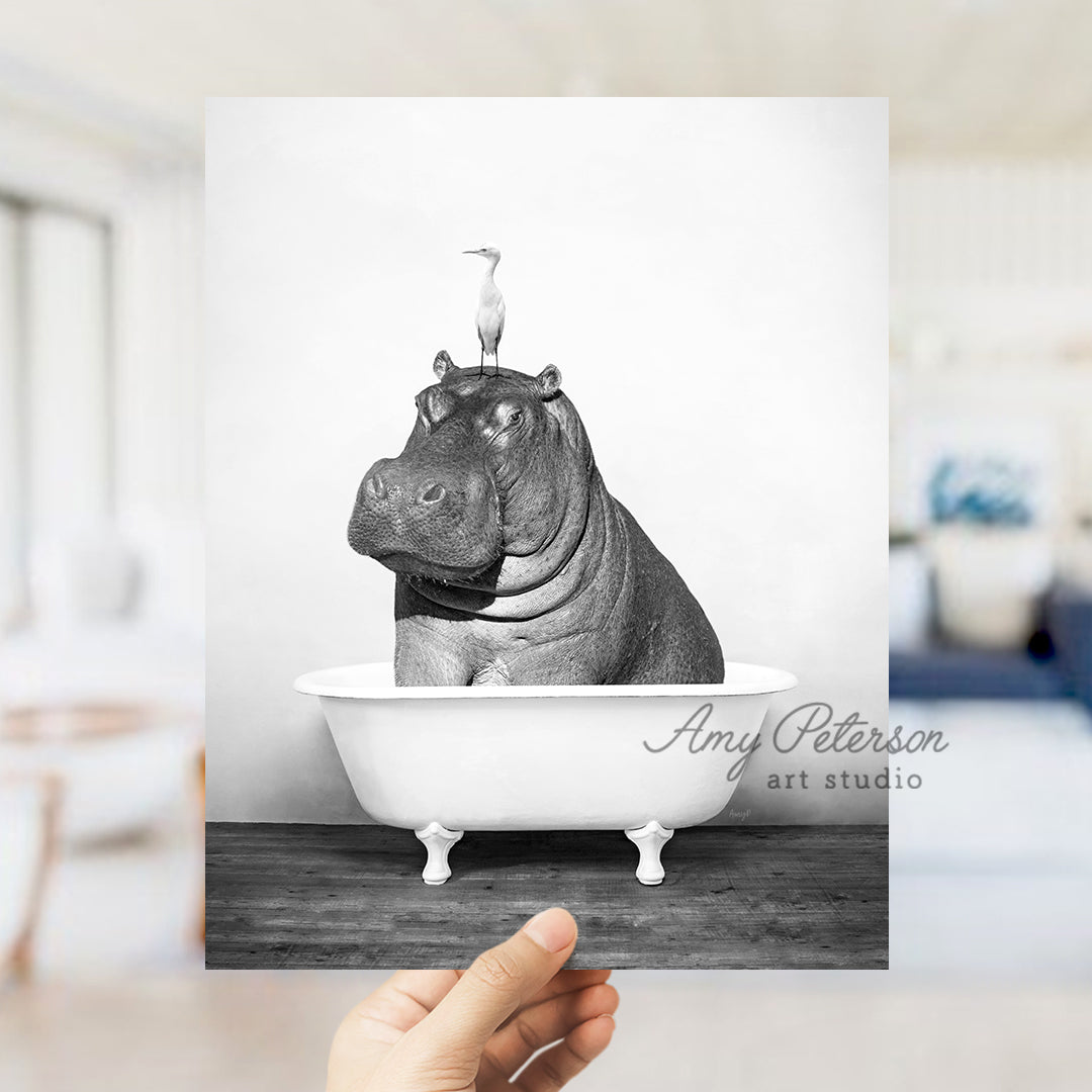 a black and white photo of a hippo in a bathtub