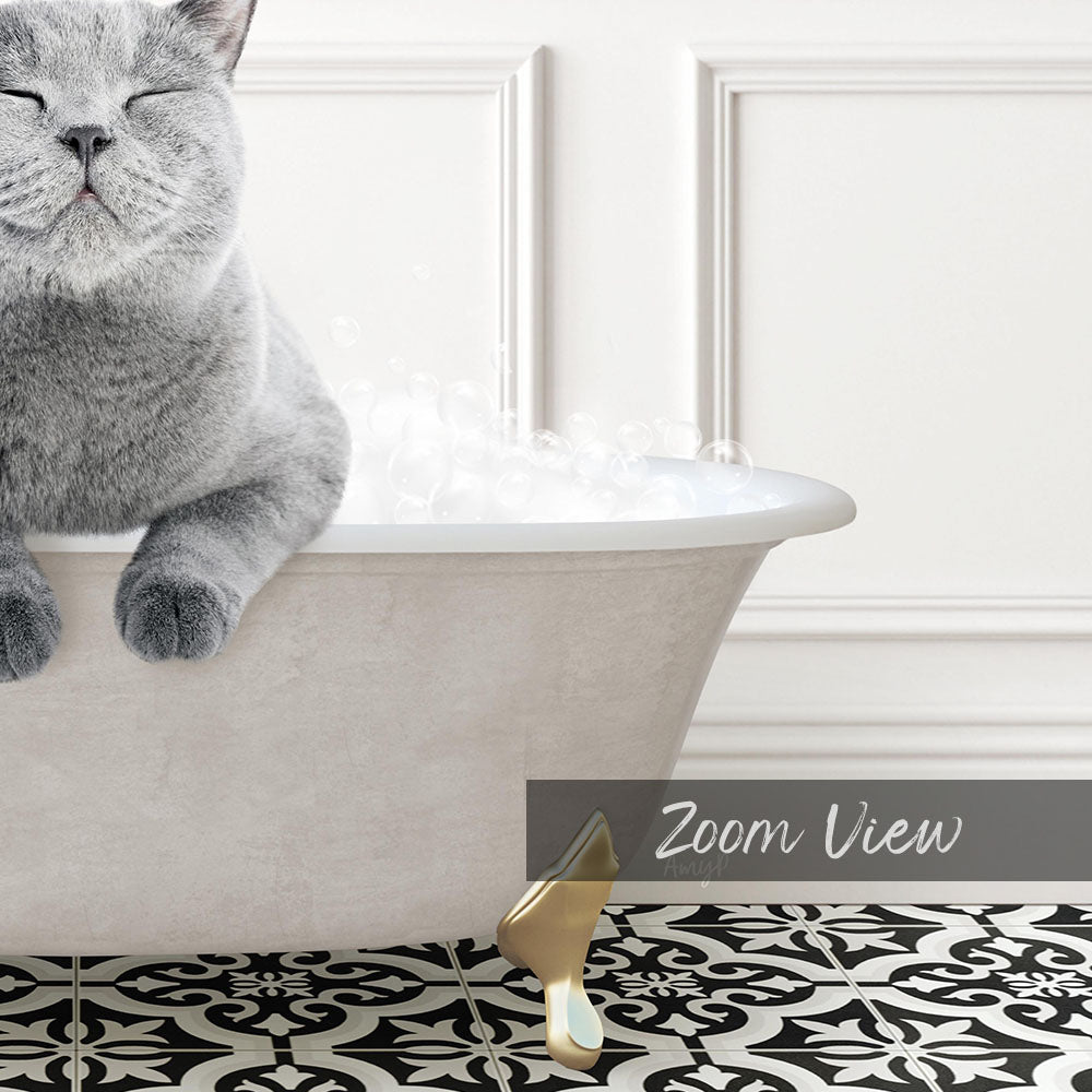 A gray cat sitting in a white bathtub filled with bubbles, with a black and white patterned floor in the foreground.