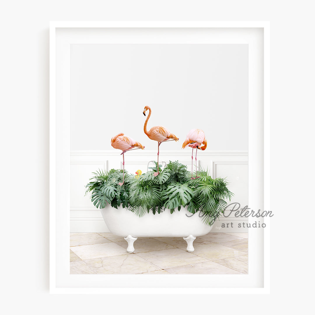 a picture of three flamingos in a bathtub