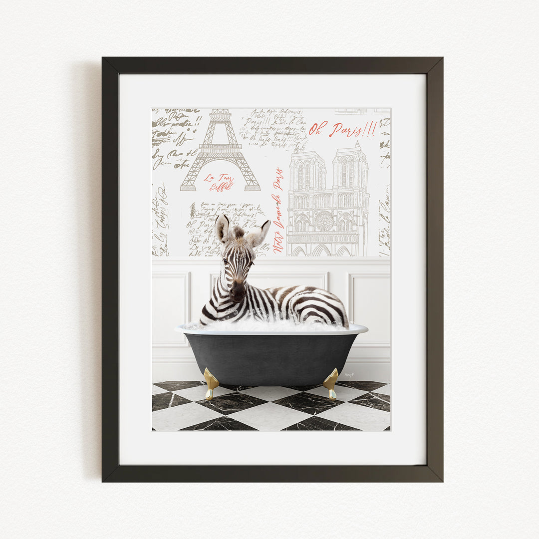 A zebra is sitting in a bathtub, surrounded by a black and white checkered floor and a framed picture of the Eiffel Tower in the background.