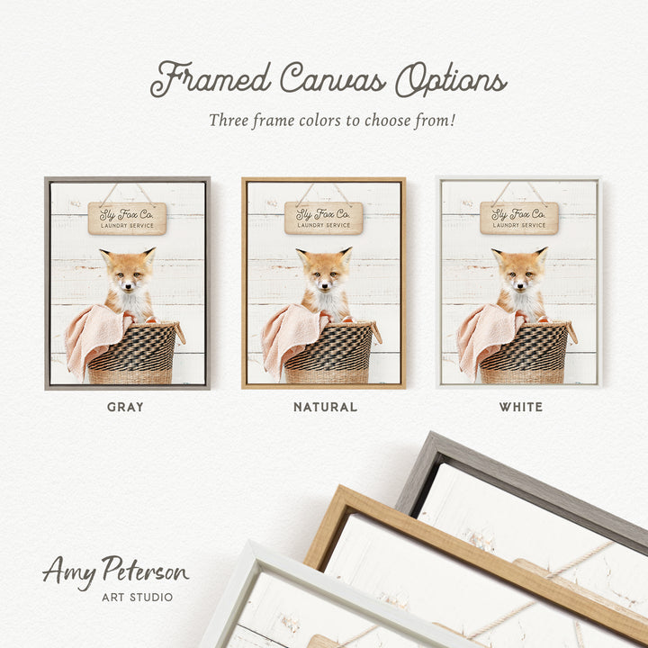 The image is a framed canvas option featuring three different framed pictures of a small orange and white fox sitting in a basket. The options include a gray, a natural, and a white frame.