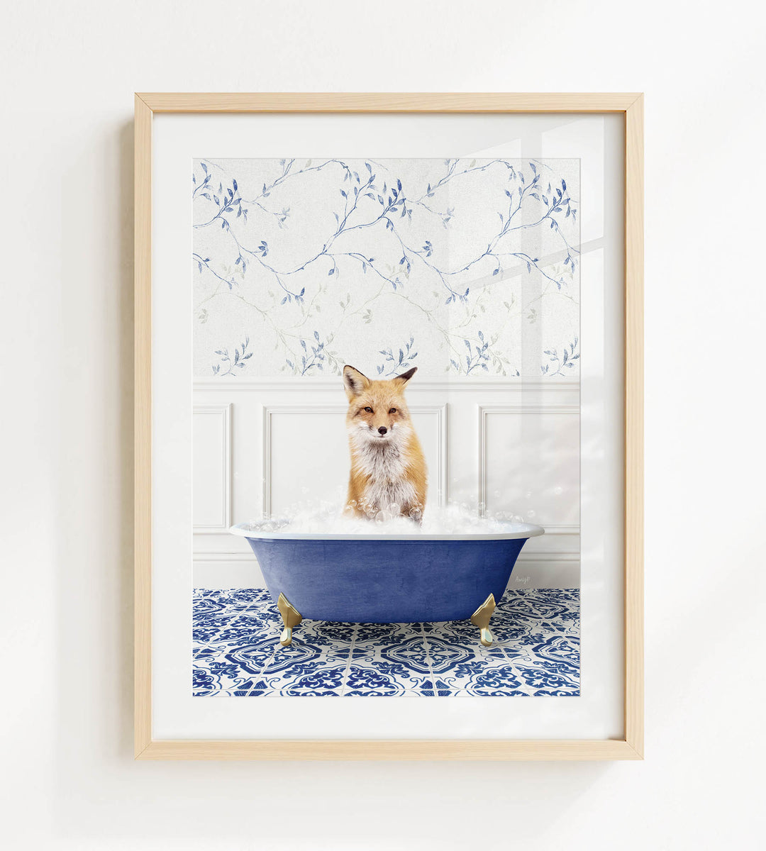 A fox is sitting in a blue bathtub filled with bubbles, surrounded by a patterned tile floor and a white wall with blue floral wallpaper.