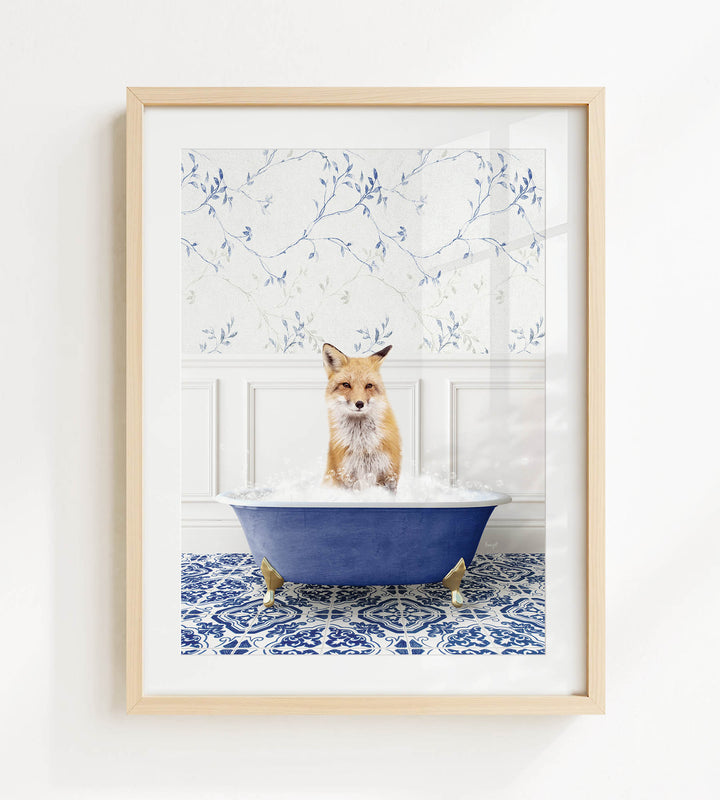 A fox is sitting in a blue bathtub filled with bubbles, surrounded by a patterned tile floor and a white wall with blue floral wallpaper.
