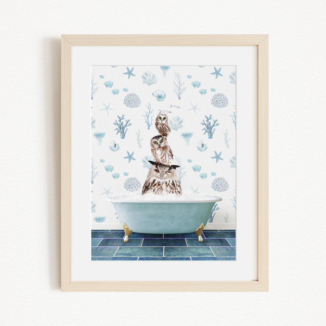 A framed print depicting a bird perched on the edge of a bathtub filled with water, surrounded by a pattern of blue and white seashells and starfish.