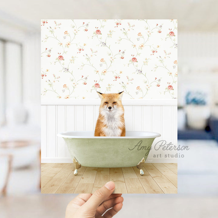 a hand holding up a card with a picture of a fox in a bathtub