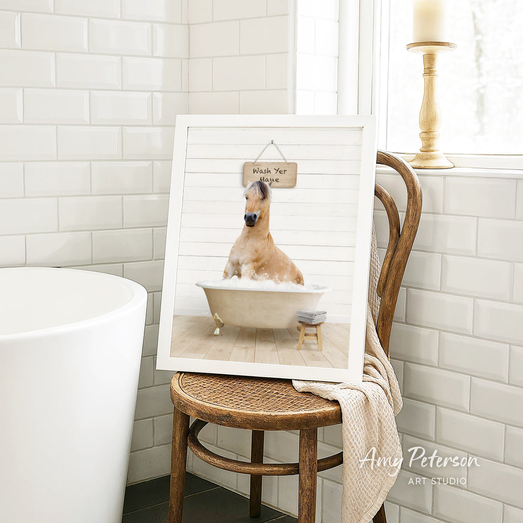A framed image of a dog sitting in a bathtub, with a sign above it that says "Wash Your Horse".