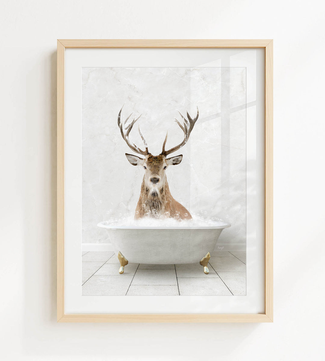 A deer with large antlers is sitting in a white bathtub filled with water, creating a whimsical and unexpected scene.