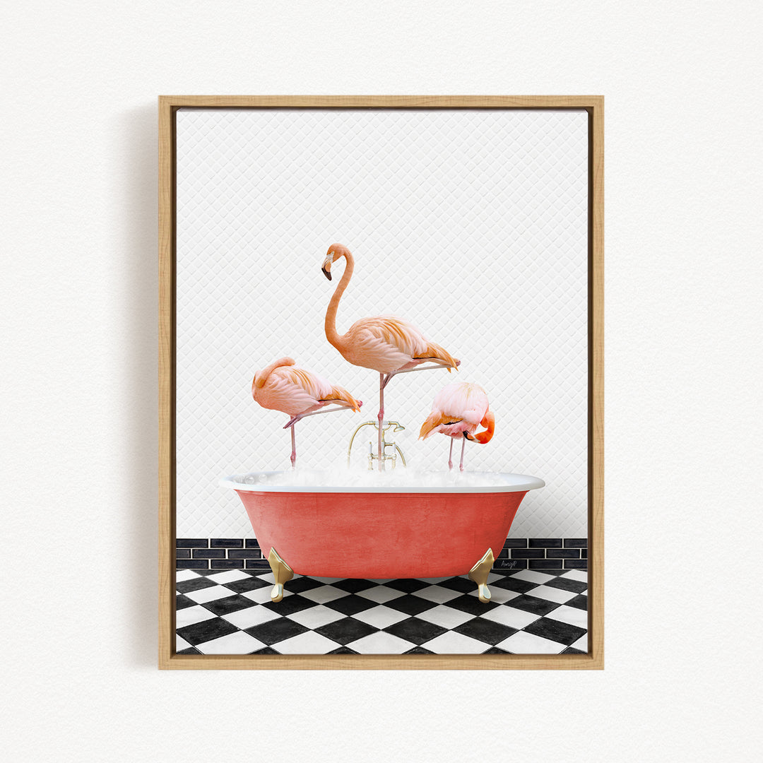 A framed image depicting three pink flamingos standing in a red bathtub on a black and white checkered floor.