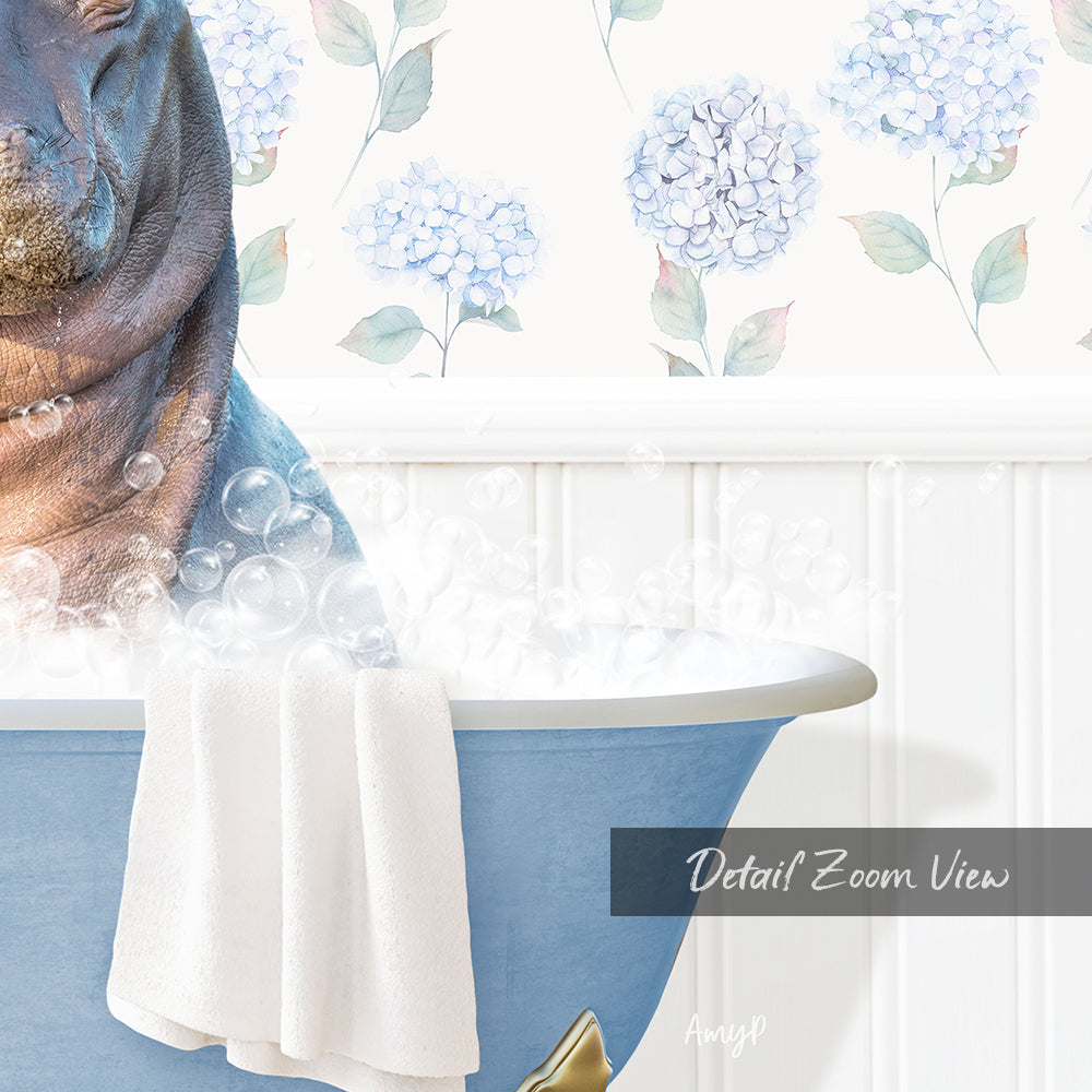 A close-up of a bathtub filled with bubbles, with a towel draped over the side and a floral pattern on the wall behind it.
