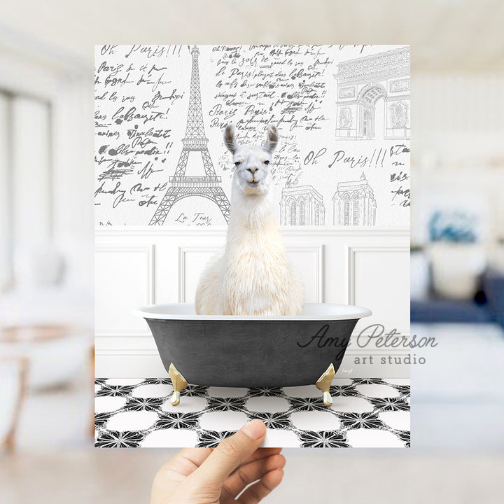 a llama is sitting in a bathtub in front of the eiffel