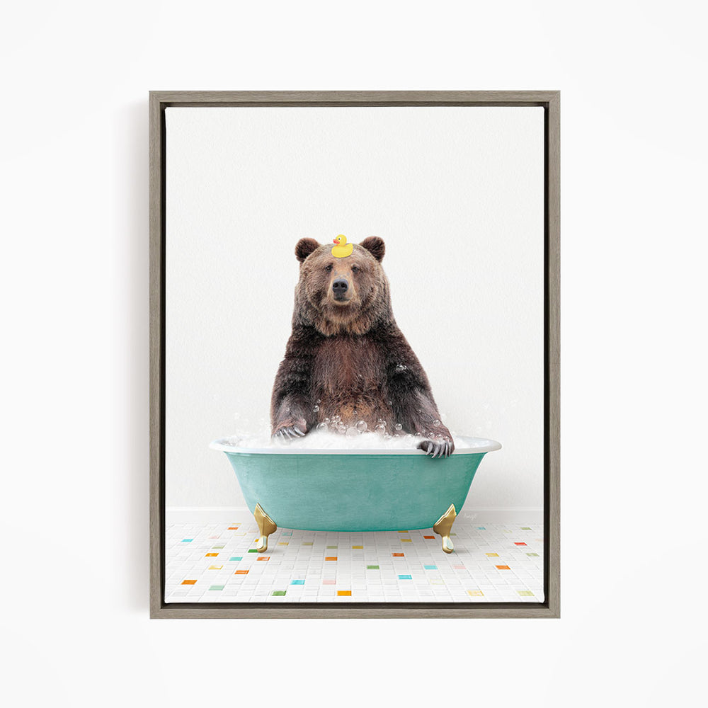 A brown bear sitting in a green bathtub filled with bubbles, wearing a yellow hat.