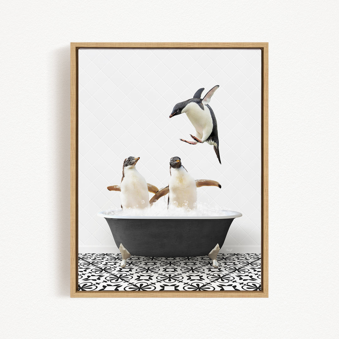 A framed image depicting two penguins sitting in a bathtub, with one penguin flying towards the other penguin.