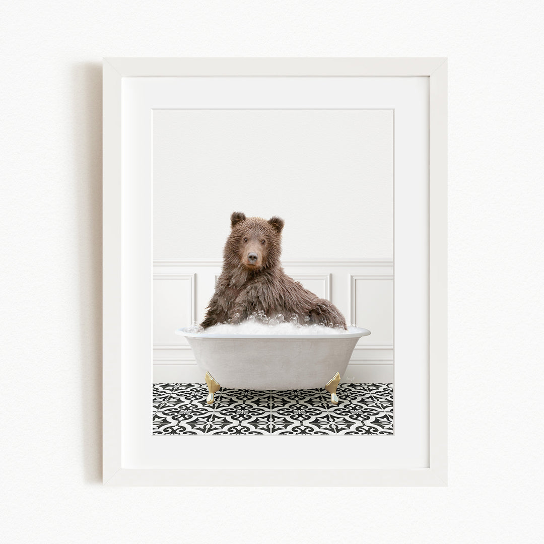A brown bear sitting in a white bathtub filled with water, surrounded by a black and white patterned floor.