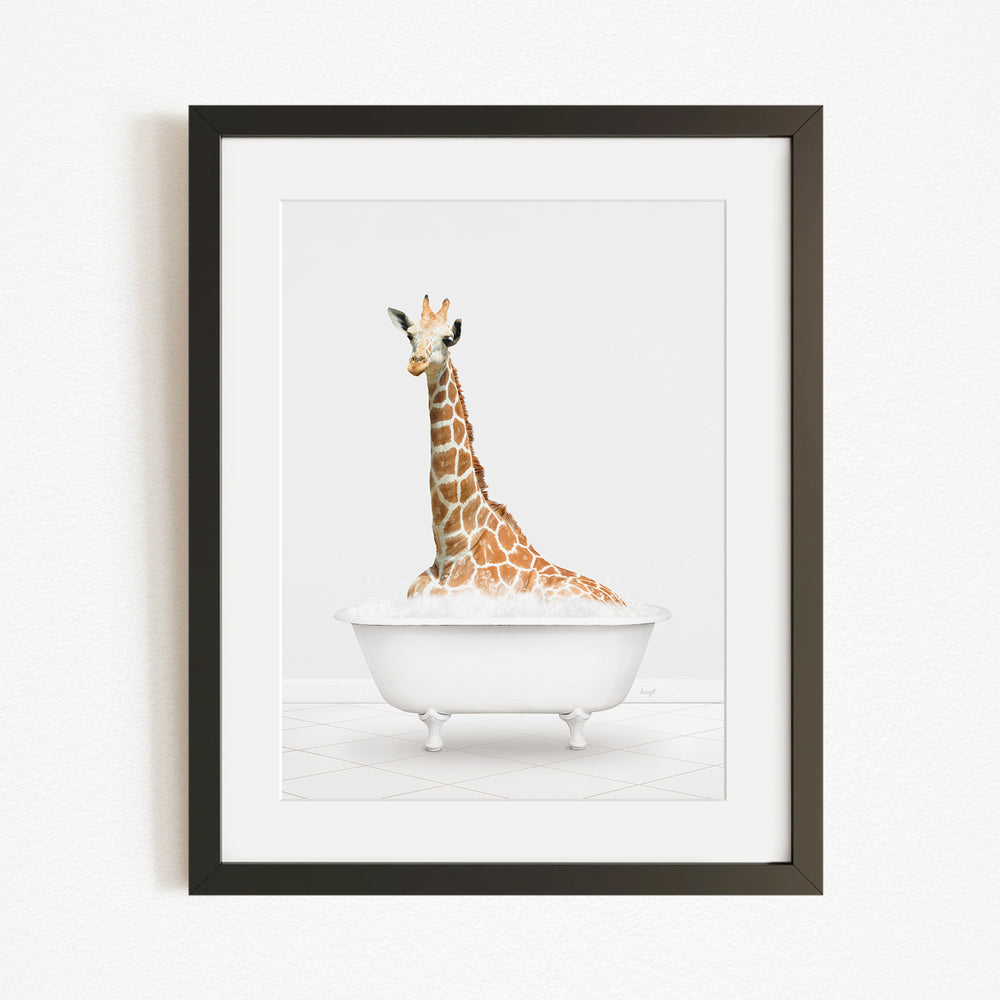 A giraffe sitting in a white bathtub, with its head and neck submerged in the water.
