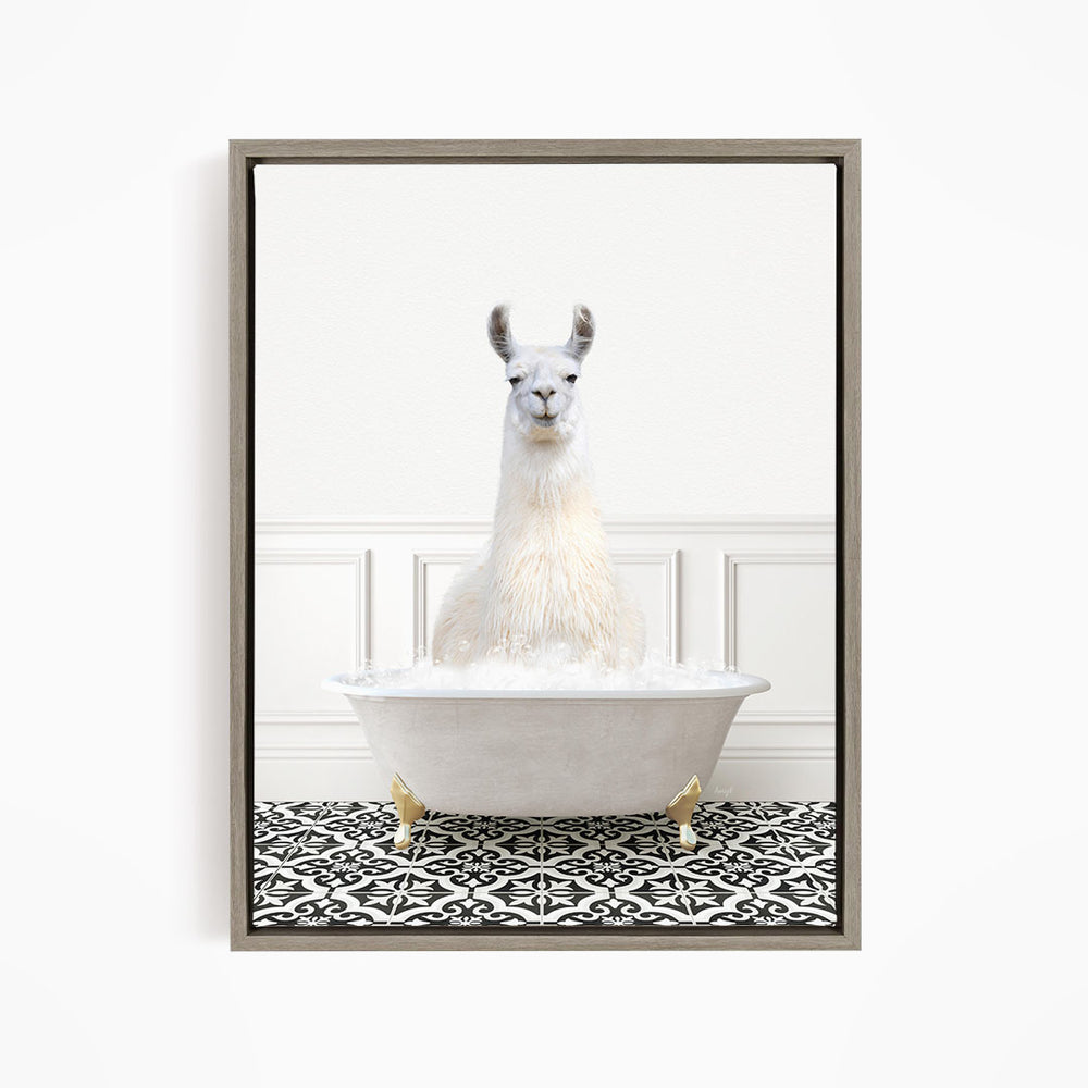 A white llama sitting in a white bathtub filled with bubbles, surrounded by a black and white patterned floor.
