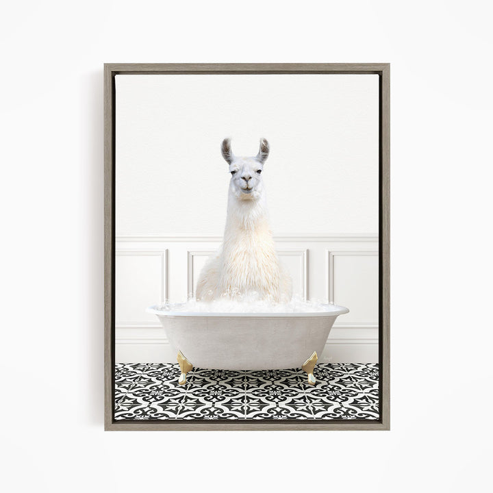 A white llama sitting in a white bathtub filled with bubbles, surrounded by a black and white patterned floor.