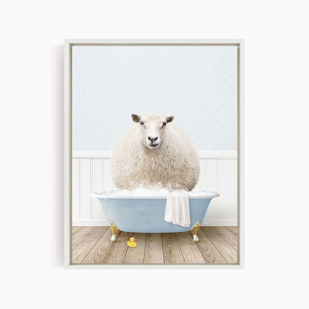 A fluffy white sheep sits in a blue bathtub filled with bubbles, surrounded by yellow rubber duckies.