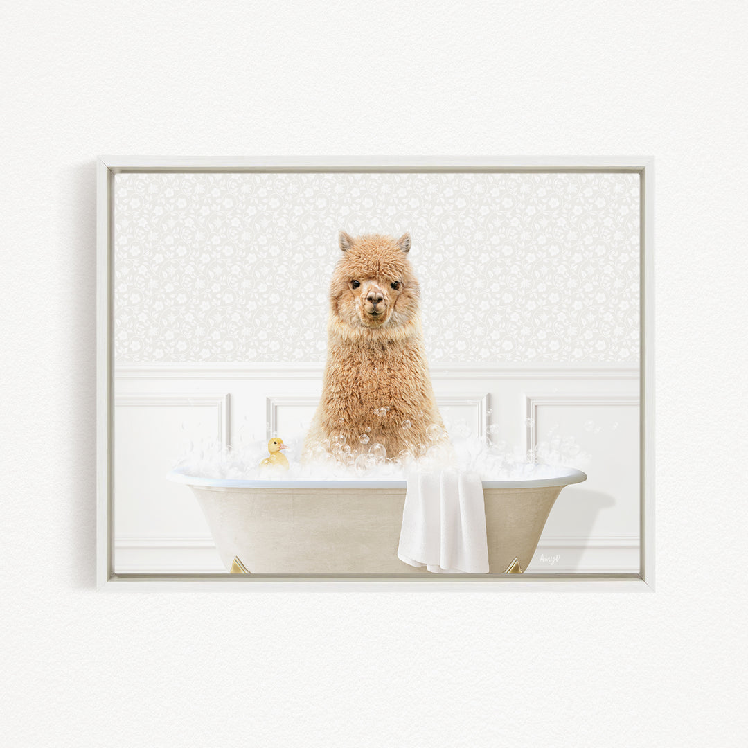 A fluffy brown alpaca sitting in a white bathtub filled with bubbles, surrounded by a white floral patterned wall.