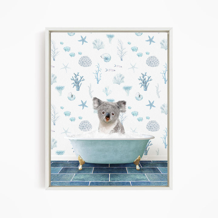 A koala bear sitting in a blue bathtub filled with bubbles, surrounded by a pattern of blue and white marine life.