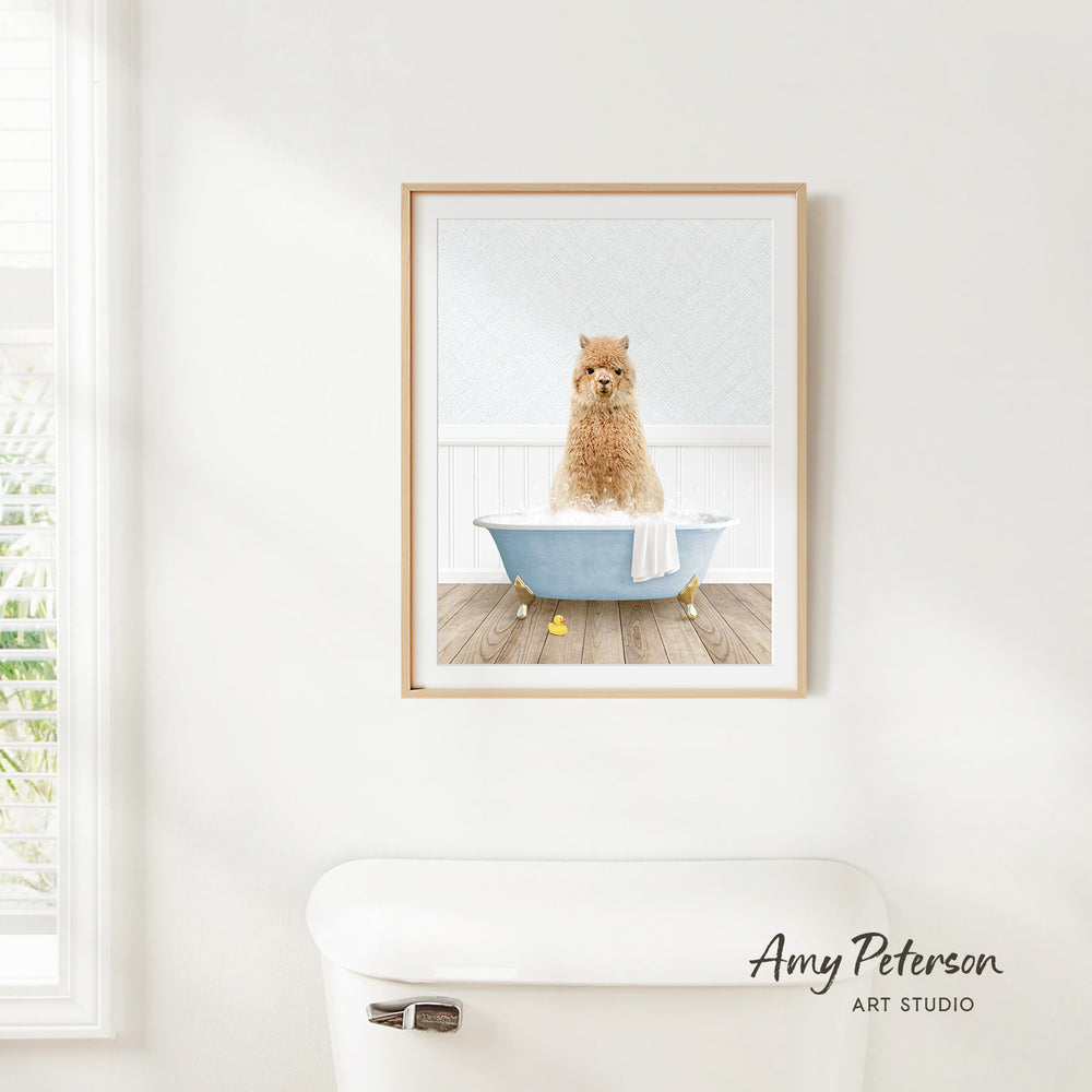 A framed print of a dog sitting in a bathtub is hanging on a white wall above a white toilet.